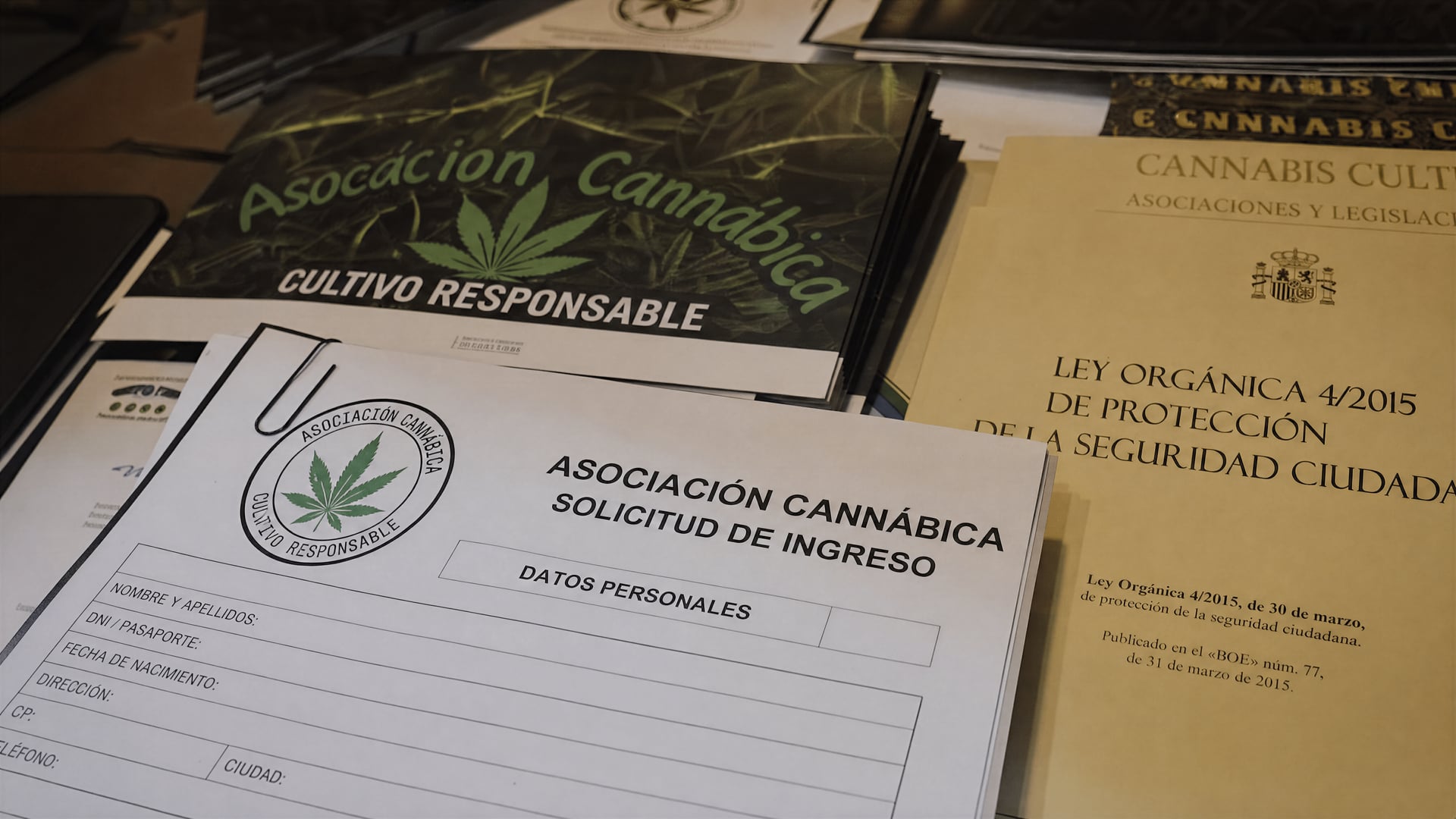 Gran Canaria association meeting table with private membership documents and Spanish legal papers